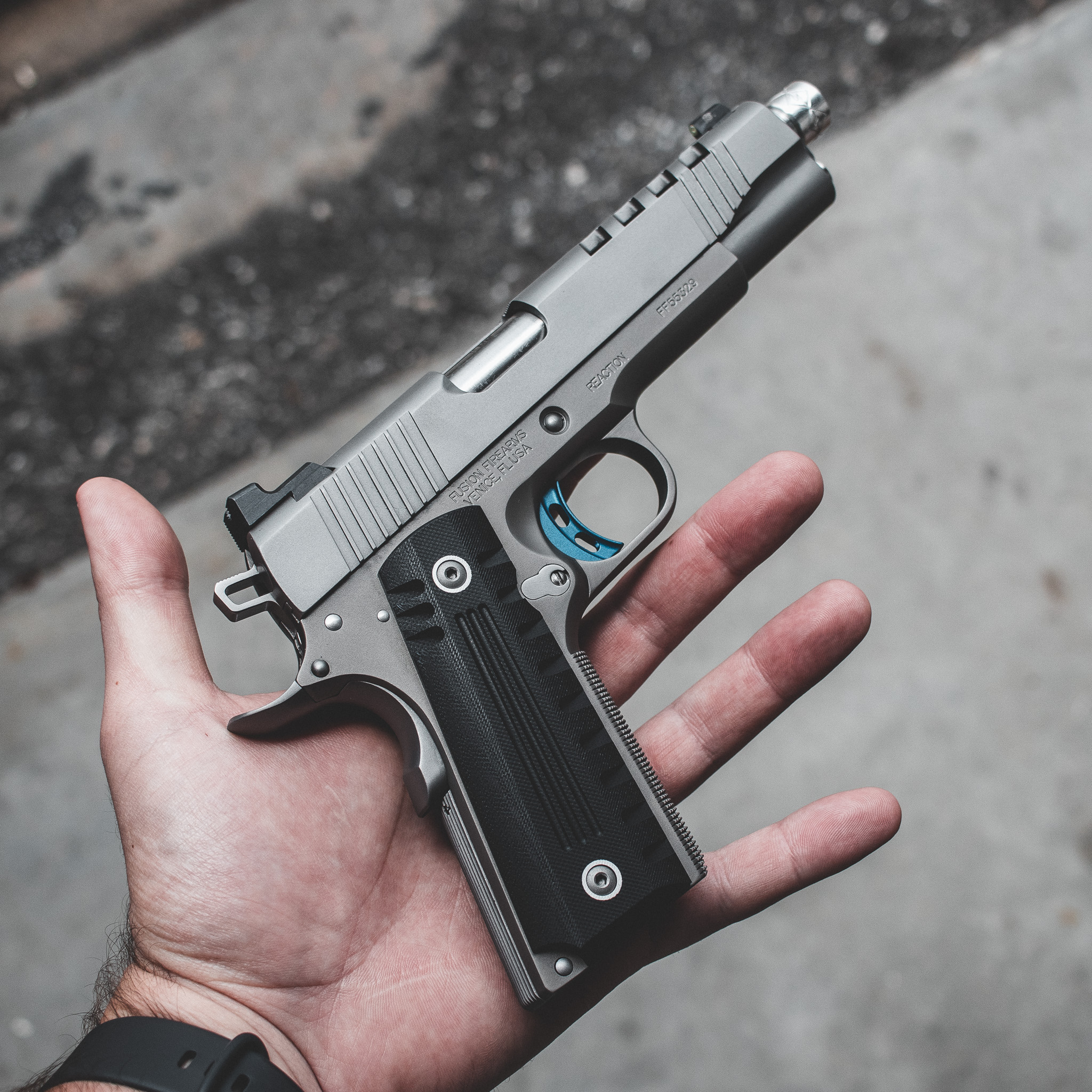 An artistic representation of a person practicing with a 1911 for self-defense