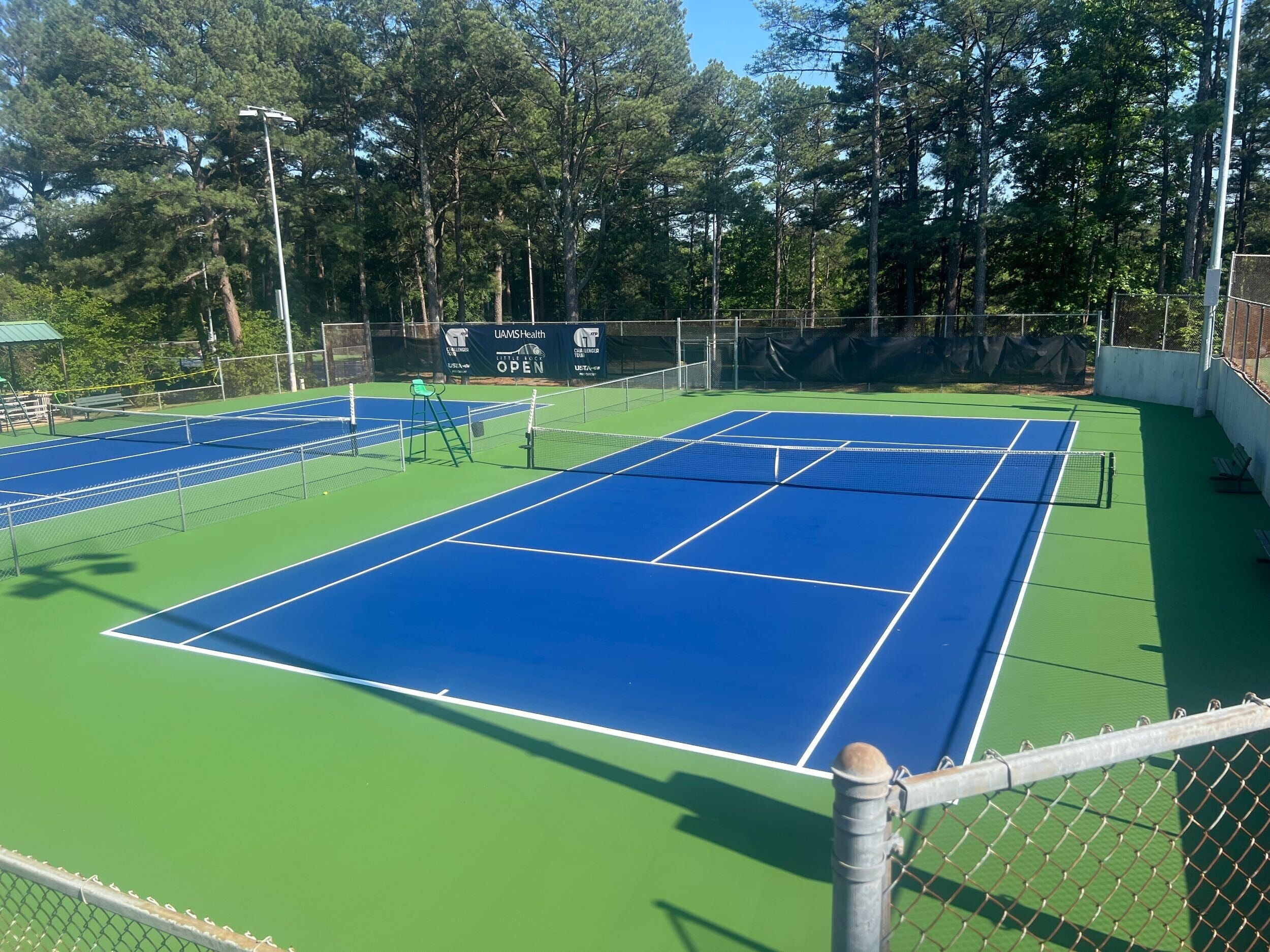 Transformation of a tennis court from faded and cracked to game-ready