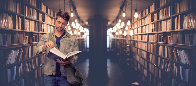 man reading in library