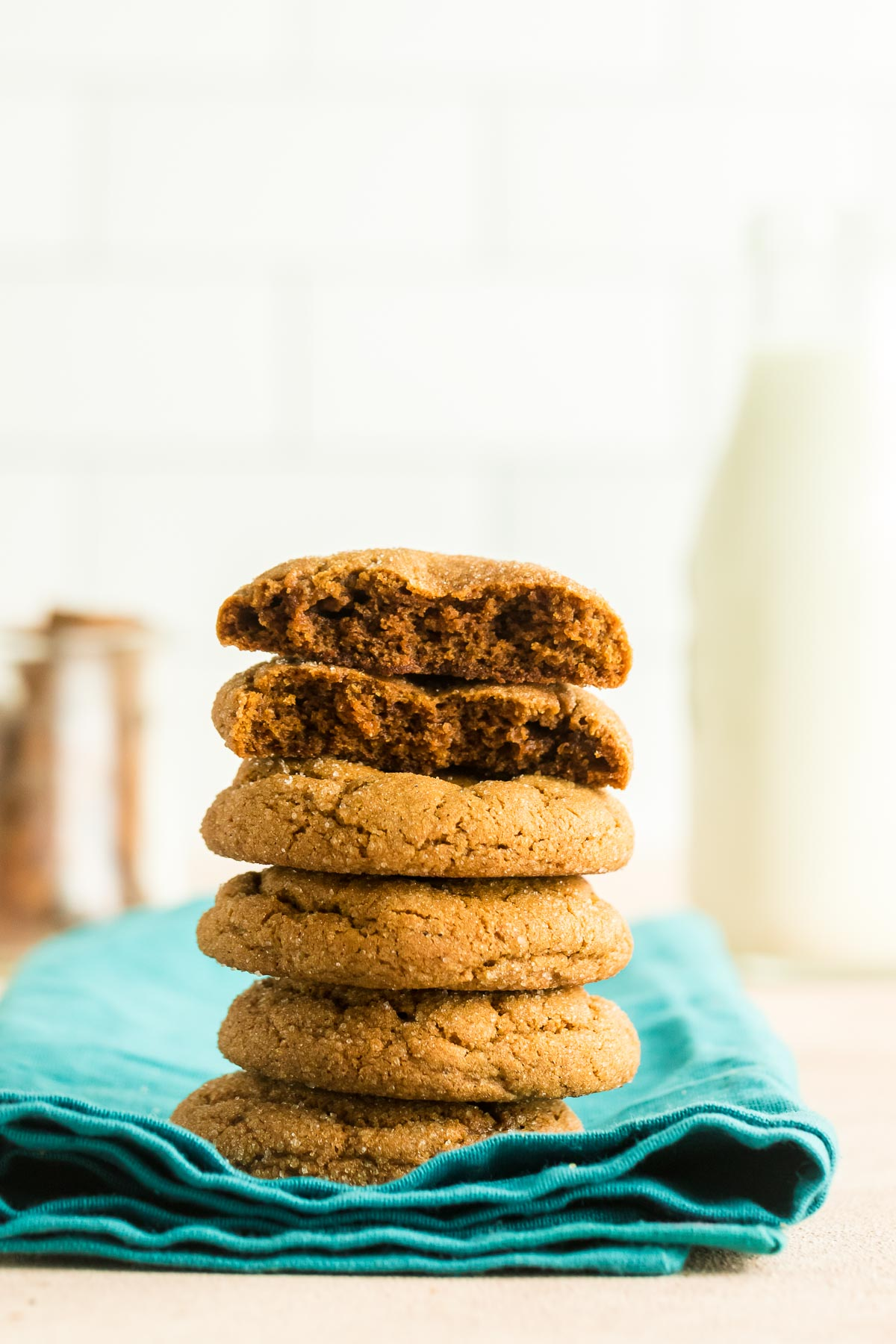 stack of molasses cookies on a teal napkin