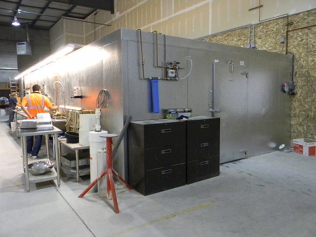 An image of a concrete curing room with humidity control equipment