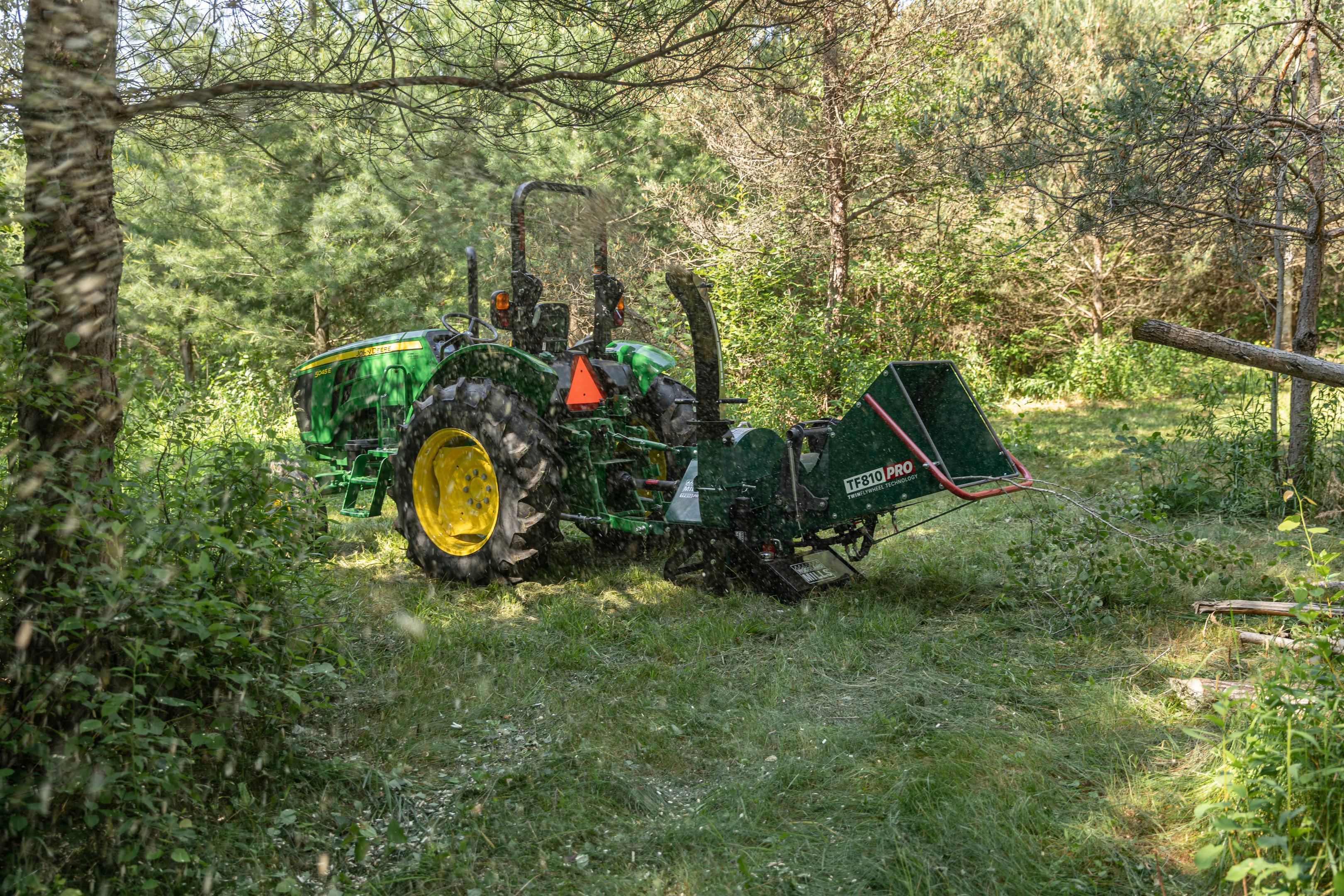 A Woodland Mills PTO wood chipper chipping an entire tree.