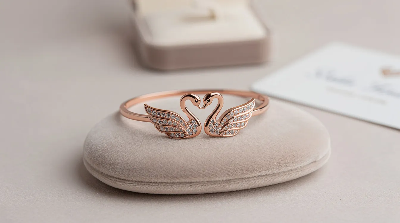 The image features an elegant swan bracelet from the Swarovski Remix Collection, showcasing a full cut crystal body with crisp clear pavé lines in a cool millennial pink hue. This double wrap bracelet, adorned with a swan motif, symbolizes grace and beauty, making it a versatile styling piece for self-expression and subtle glamour.