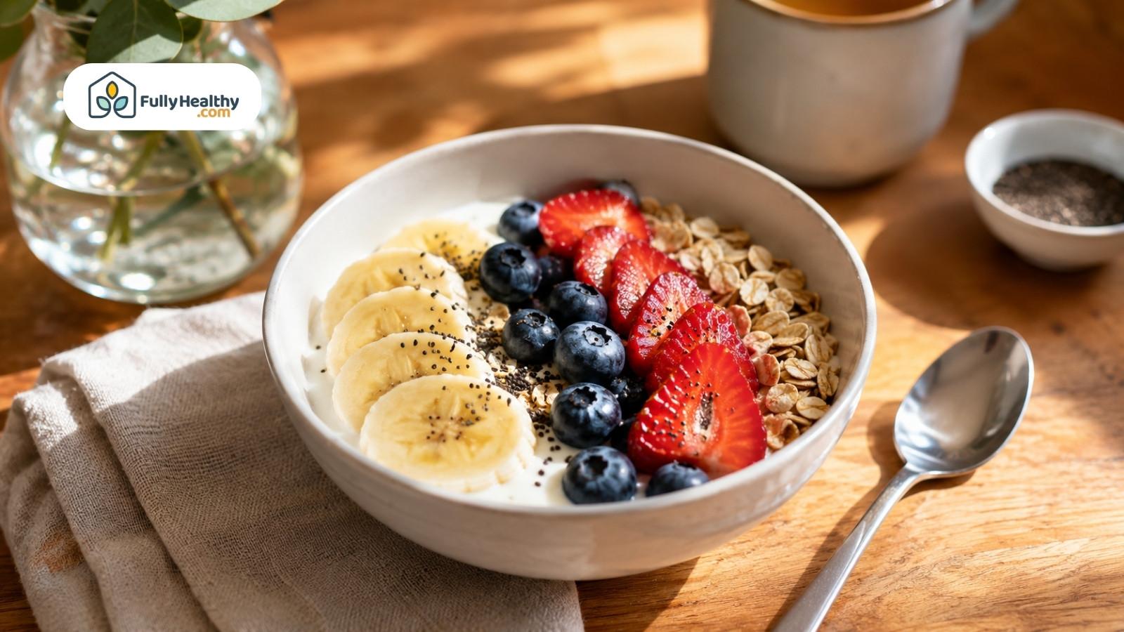 Yogurt bowl with firm banana, berries, oats, chia, and morning tea