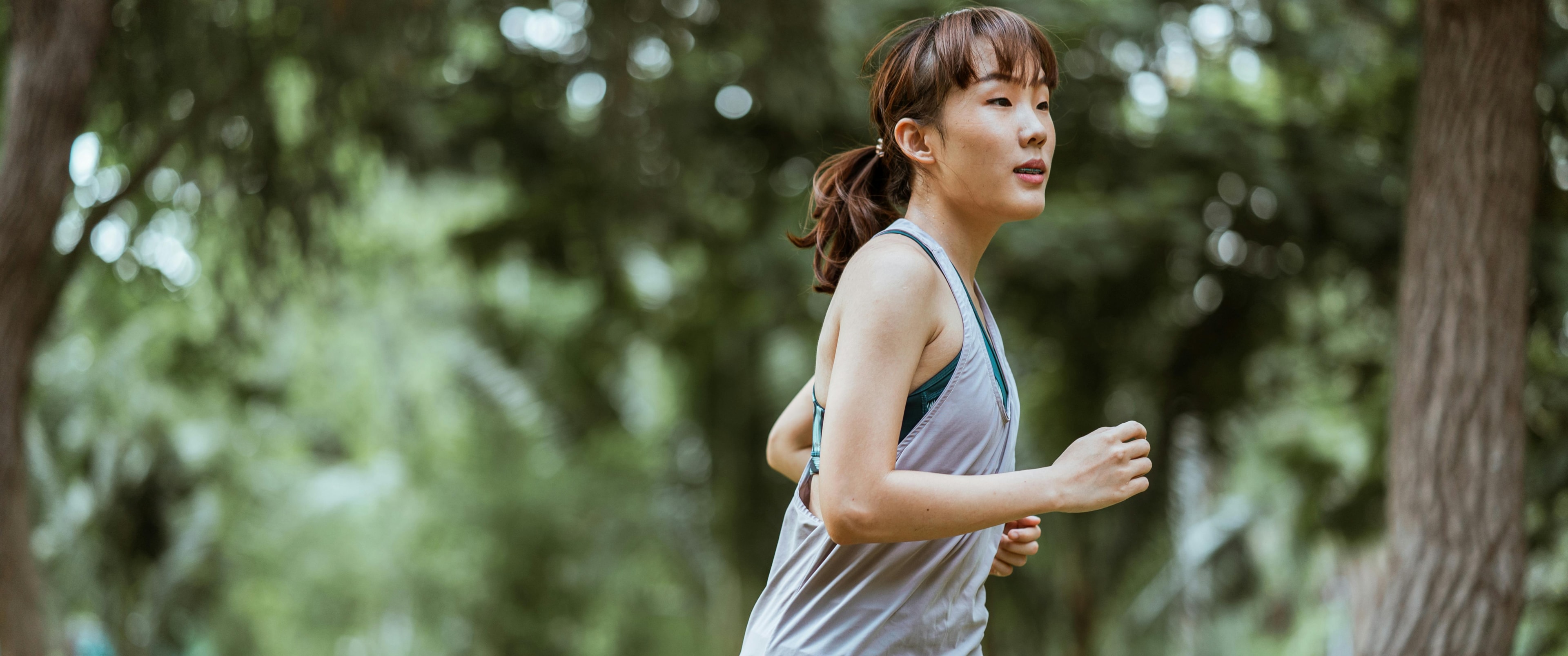 Photo by Ketut Subiyanto: https://www.pexels.com/photo/positive-asian-sportswoman-jogging-in-countryside-4426463/