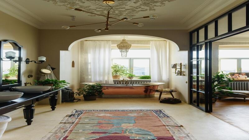 Rustic style chandelier with edison bulbs giving vintage charm to the bathroom 