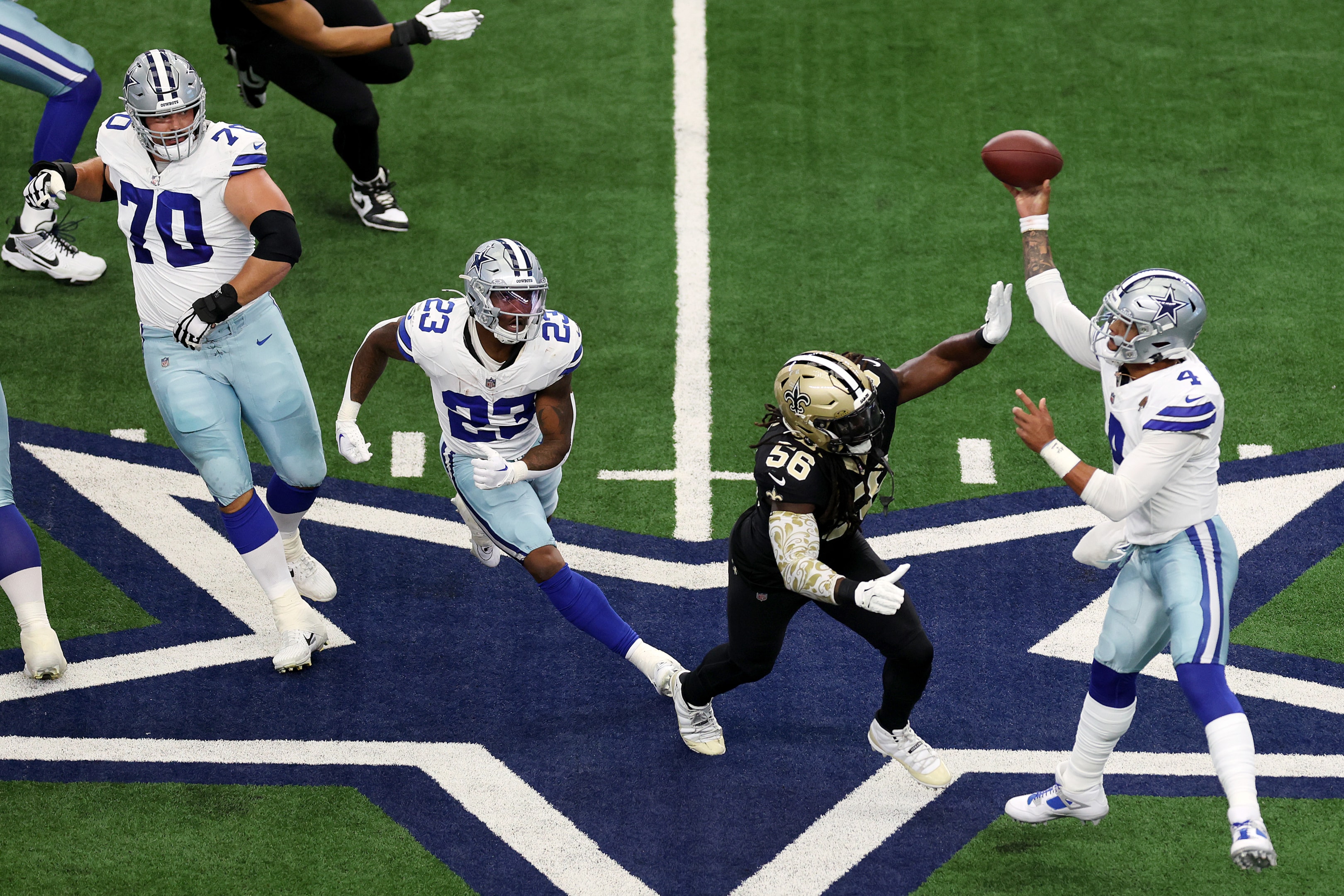 Quarterback Dak Prescott of the Dallas Cowboys looks to pass during the first quarter at AT&T Stadium on September 15, 2024 in Arlington, Texas.