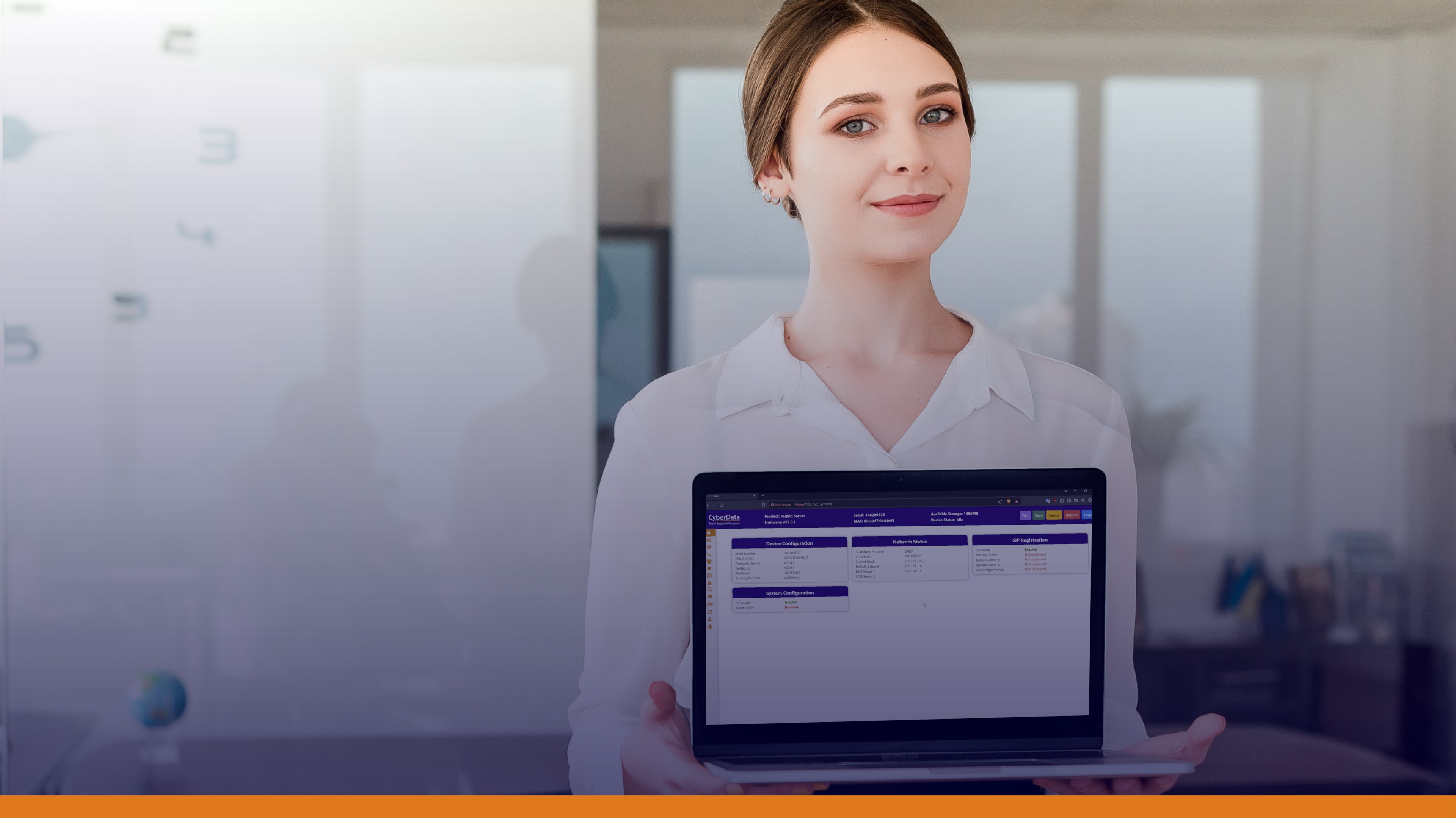 Professional woman holding a laptop displaying a CyberData interface, demonstrating emergency management tools to deliver important emergency information.