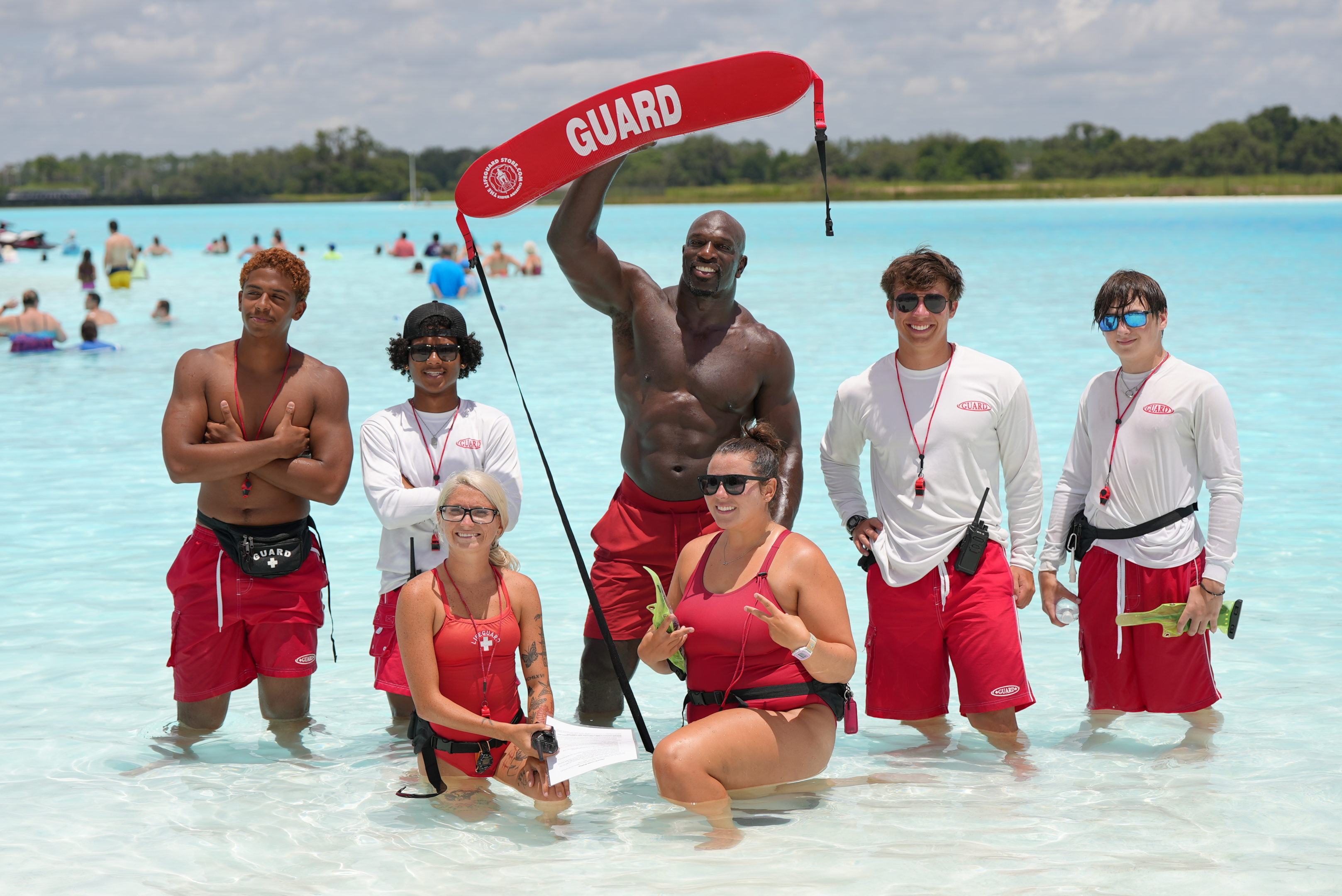 Titus O'Neil poses for a photo with the Lagoon life guards