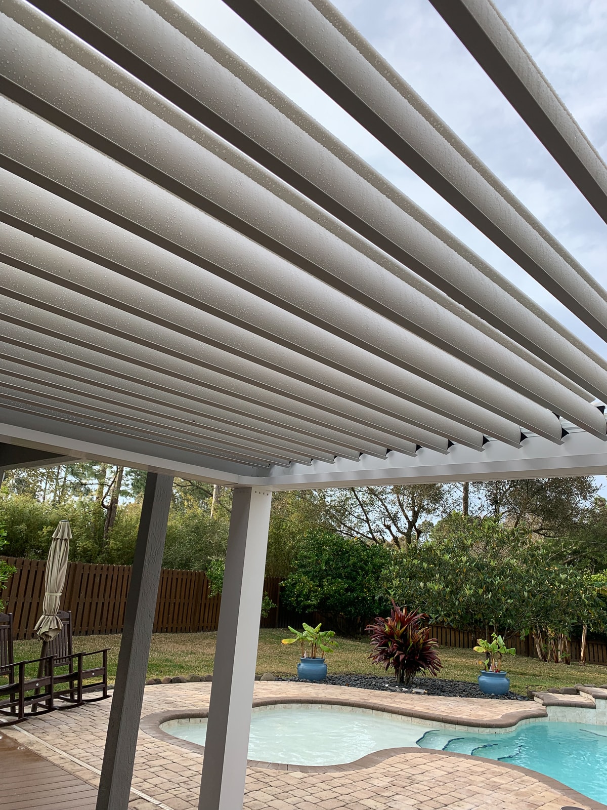 The idea of adding louvers to your pergola will increase your pergola cost a bit but will be more than worth it.