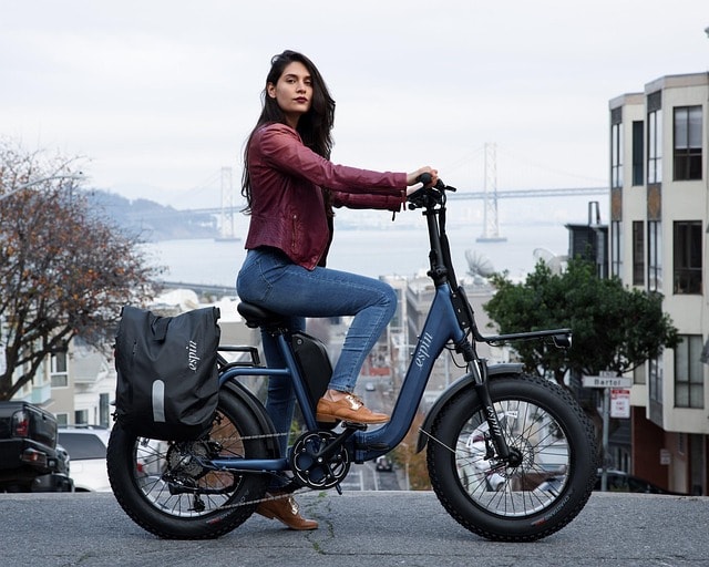 A woman on an electric commuter bike.