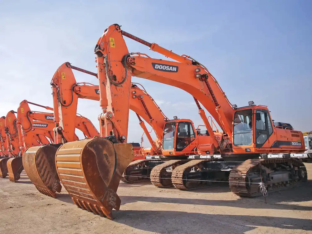 Tracked excavators are ready to perform operations.