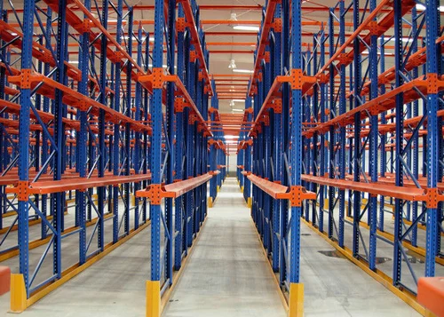 "Empty pallet racking system in a warehouse aisle, featuring industrial shelving ready for pallet storage and high-density inventory solutions"