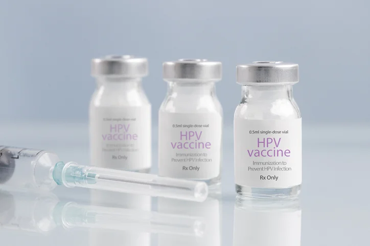 HPV vaccine vials and a syringe