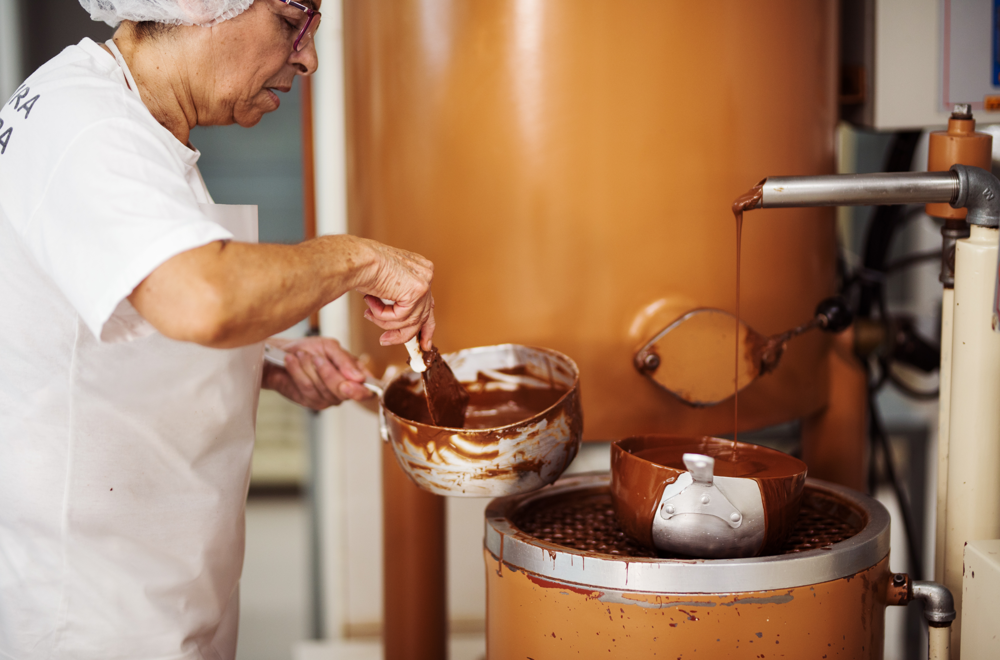 woman making cocoa  successful  a factory