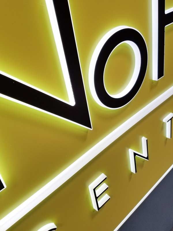 A close up view of the NoHo Centre Apartments channel letter sign using wireway mounting.