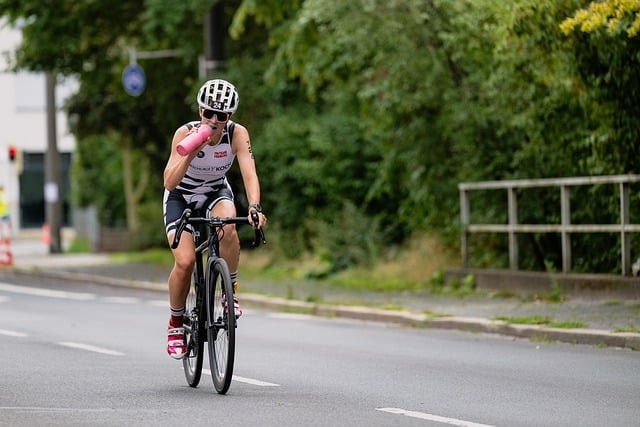 A man wearing cycling accessories including a helmet.