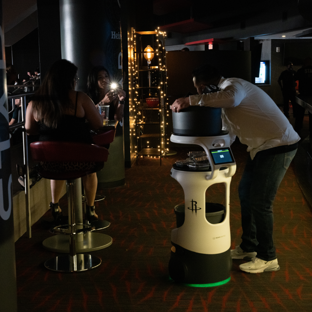 A Servi robot helping with drinks at the hotel bar.