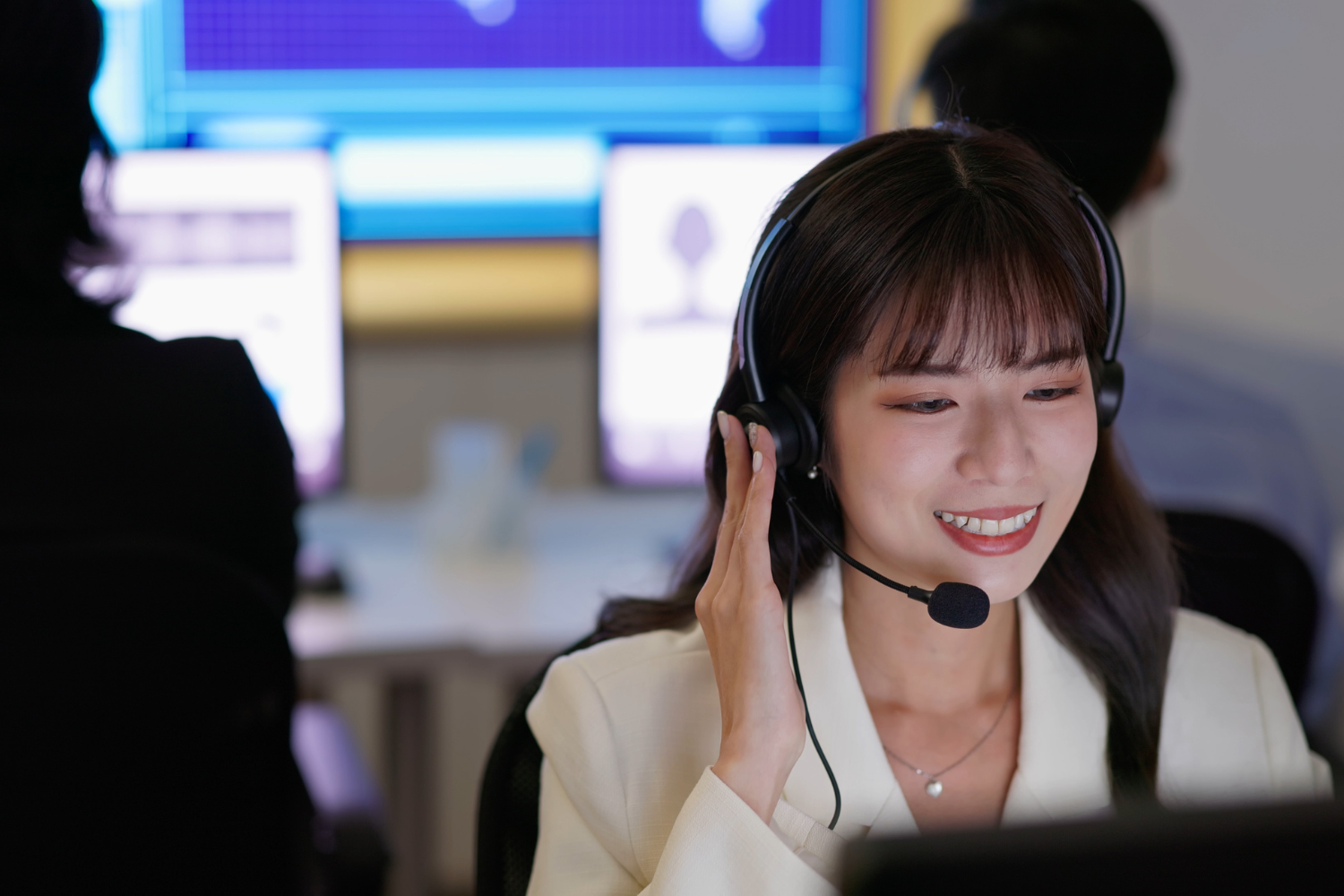 A professional customer service representative with headphones.