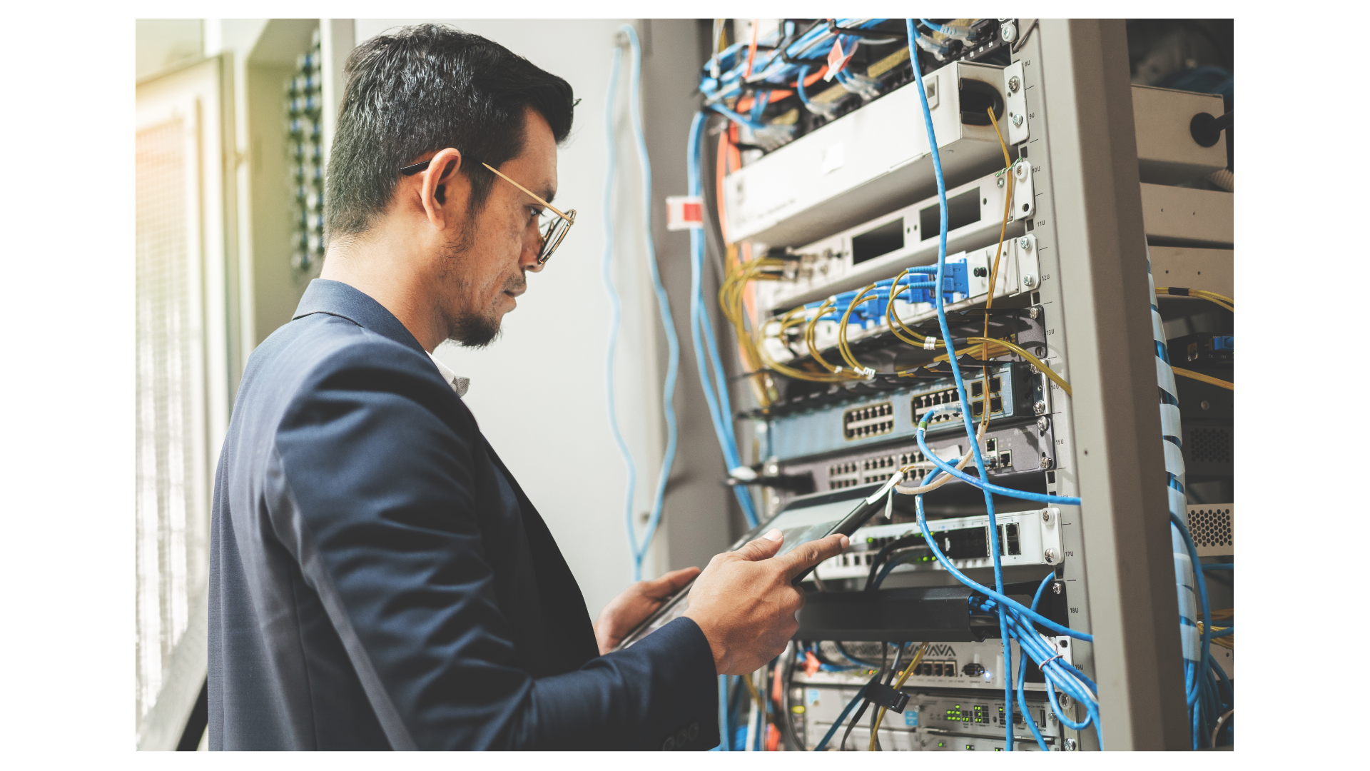 A person works in a server room.