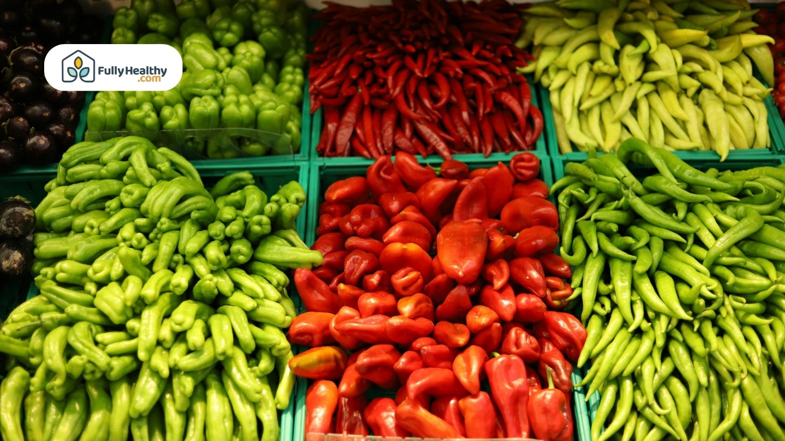 Variety of peppers in green, red, and yellow displayed in baskets