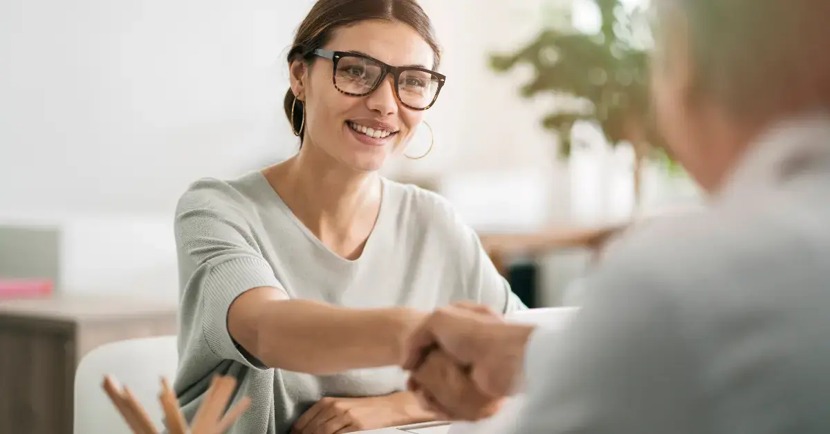Woman discussing a notice of federal tax lien with a tax professional to review IRS resolution options.