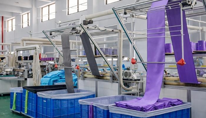 A microfiber towel factory is producing a batch