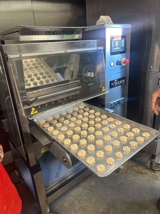 Romero's Cookie Depositor (aka San Honore after the Saint of Desserts) working with our dough or even baking, working for you!