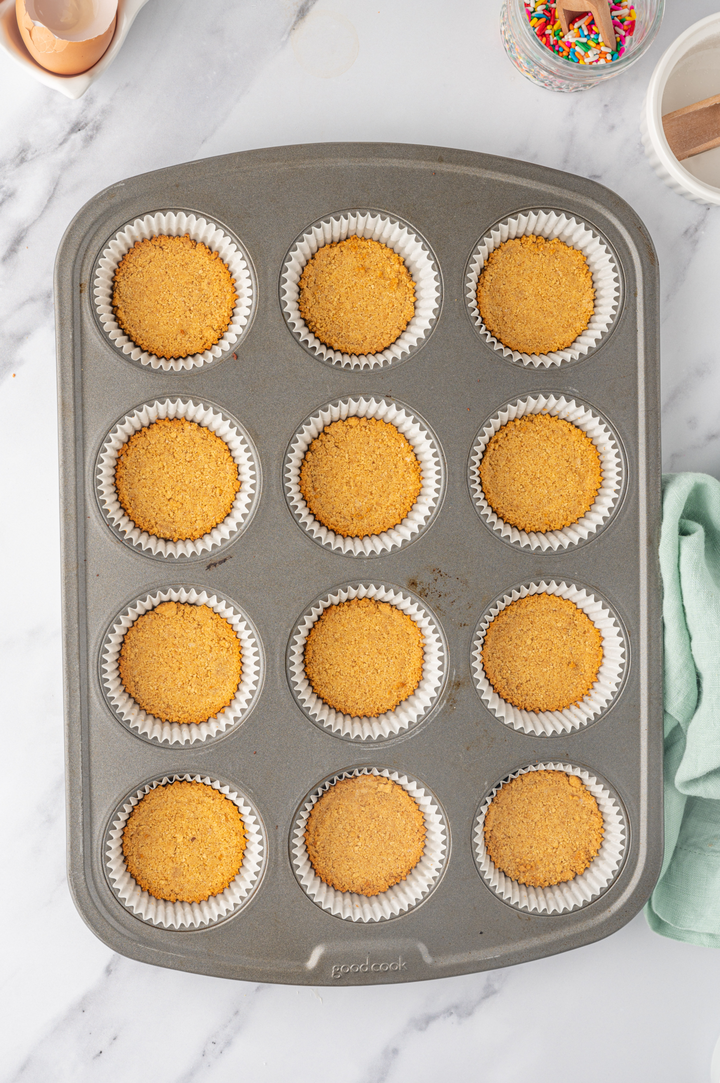 baked graham cracker crusts in muffin pan