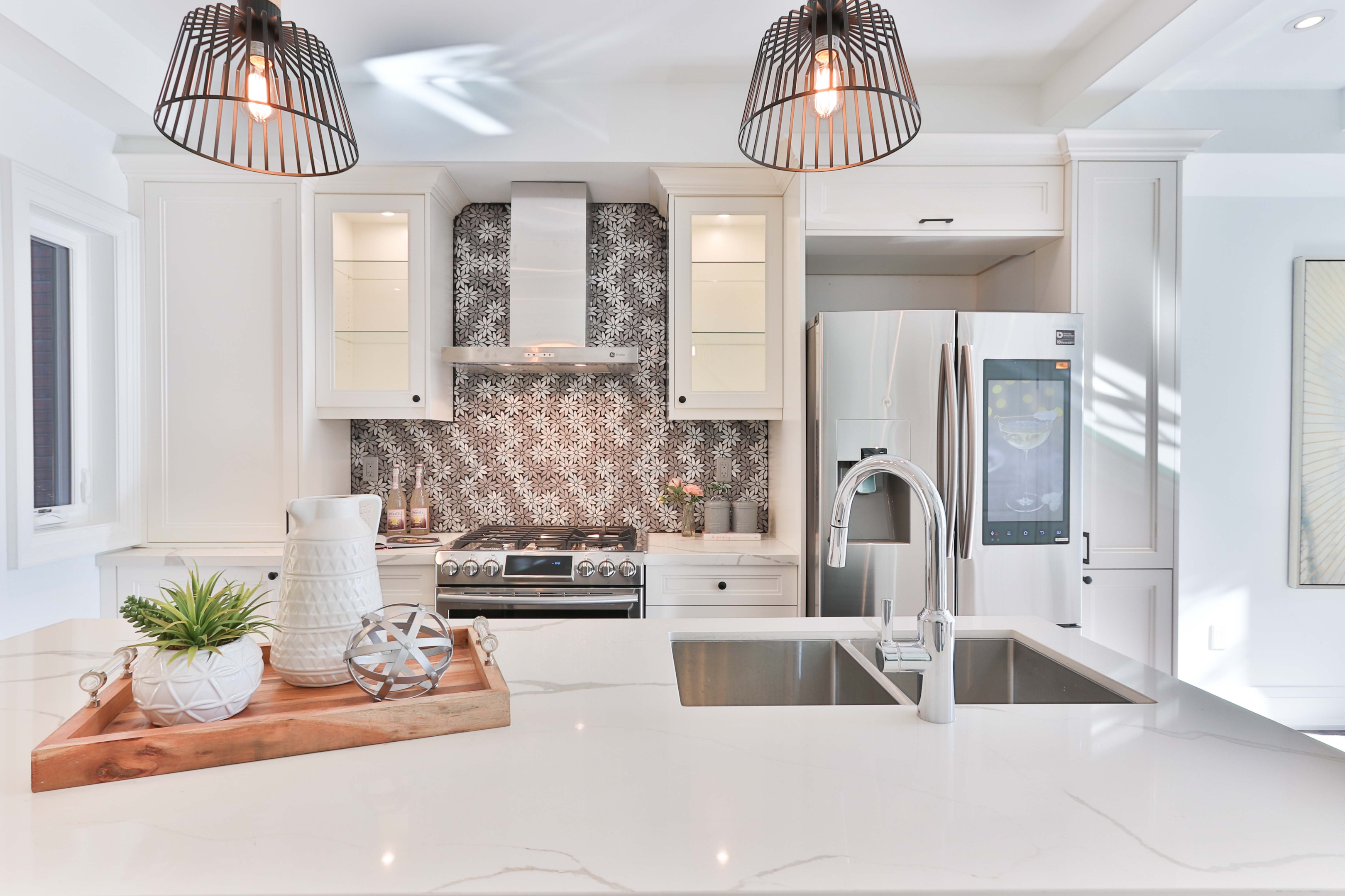 A tidy, well-lit kitchen with zero clutter and a neutral decor