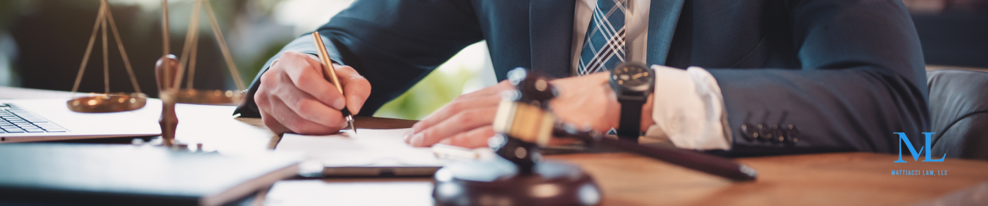 A lawyer discussing who is at fault in a left-turn collision car accident with a client injured in a car accident. 