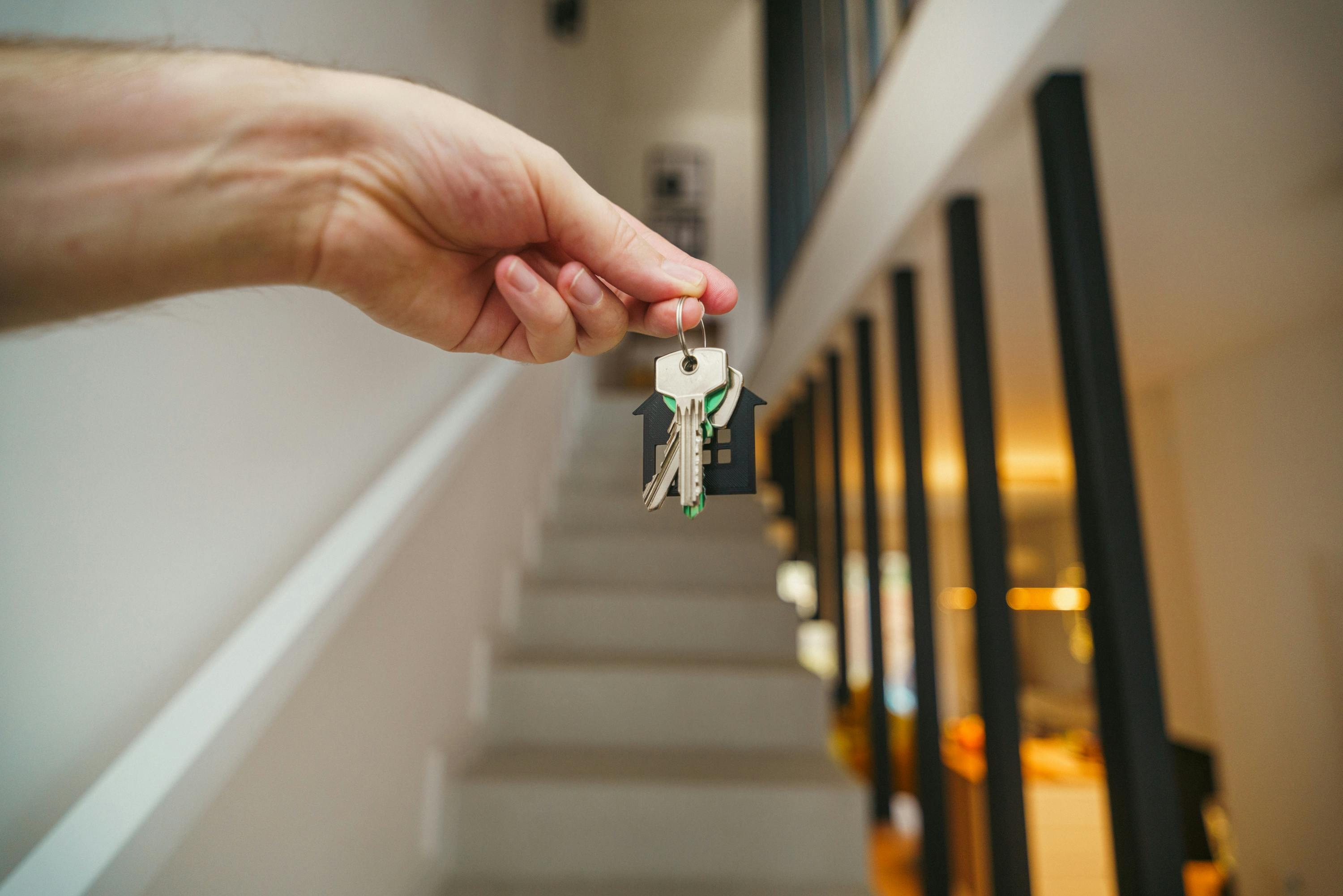 Real estate investor holds keys to property purchased from probate beneficiaries.