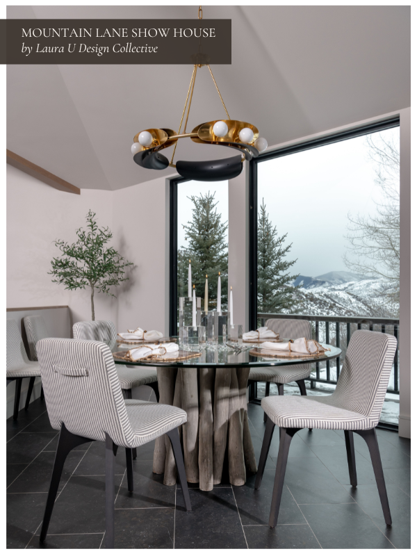 a black and white dining area with views of the mountains beyond