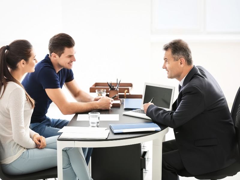 An image showing a person talking to a lawyer.
