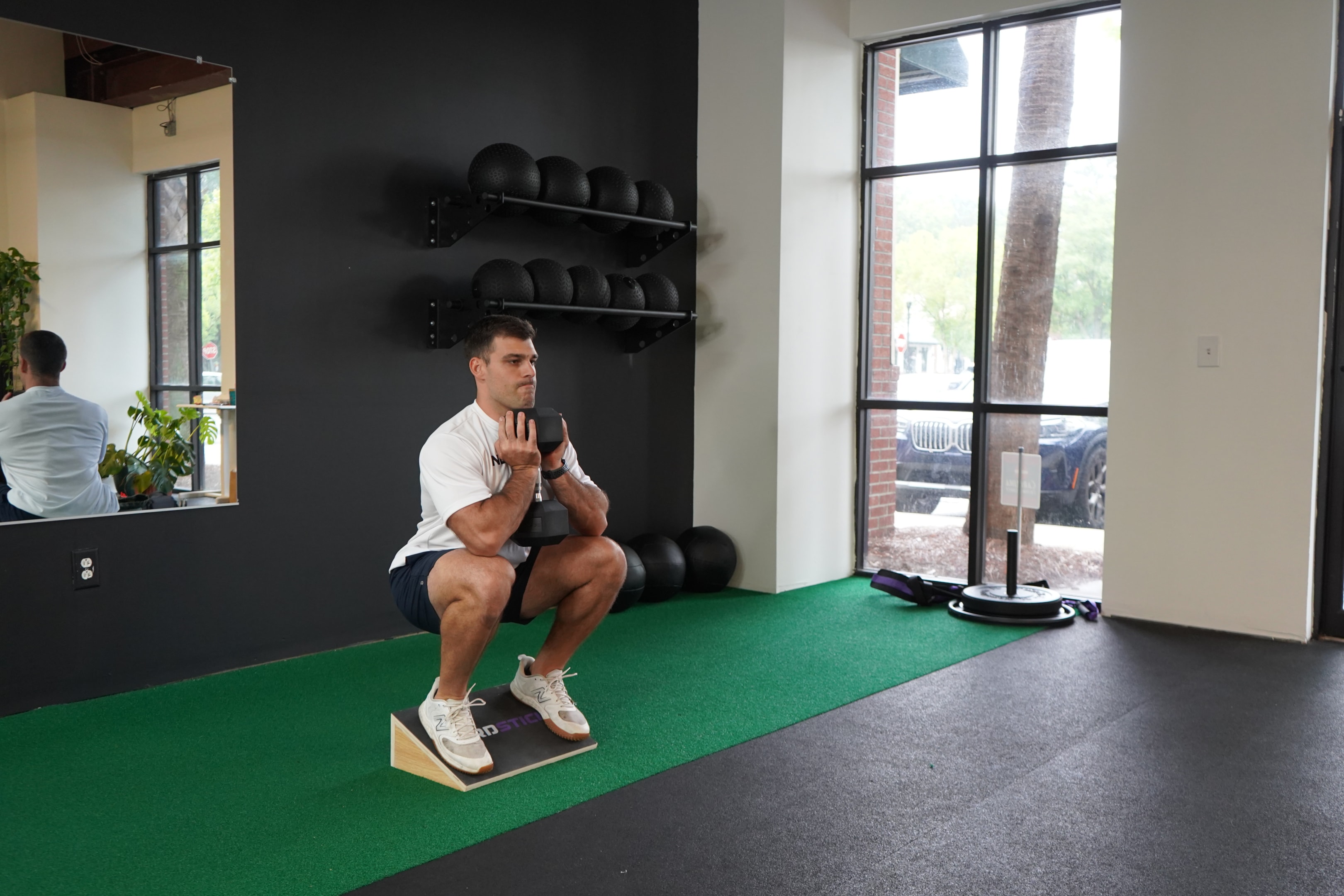 Body weight sumo squats are good, but the slant squat can be done with weights to give your lower body a deeper compound exercise.