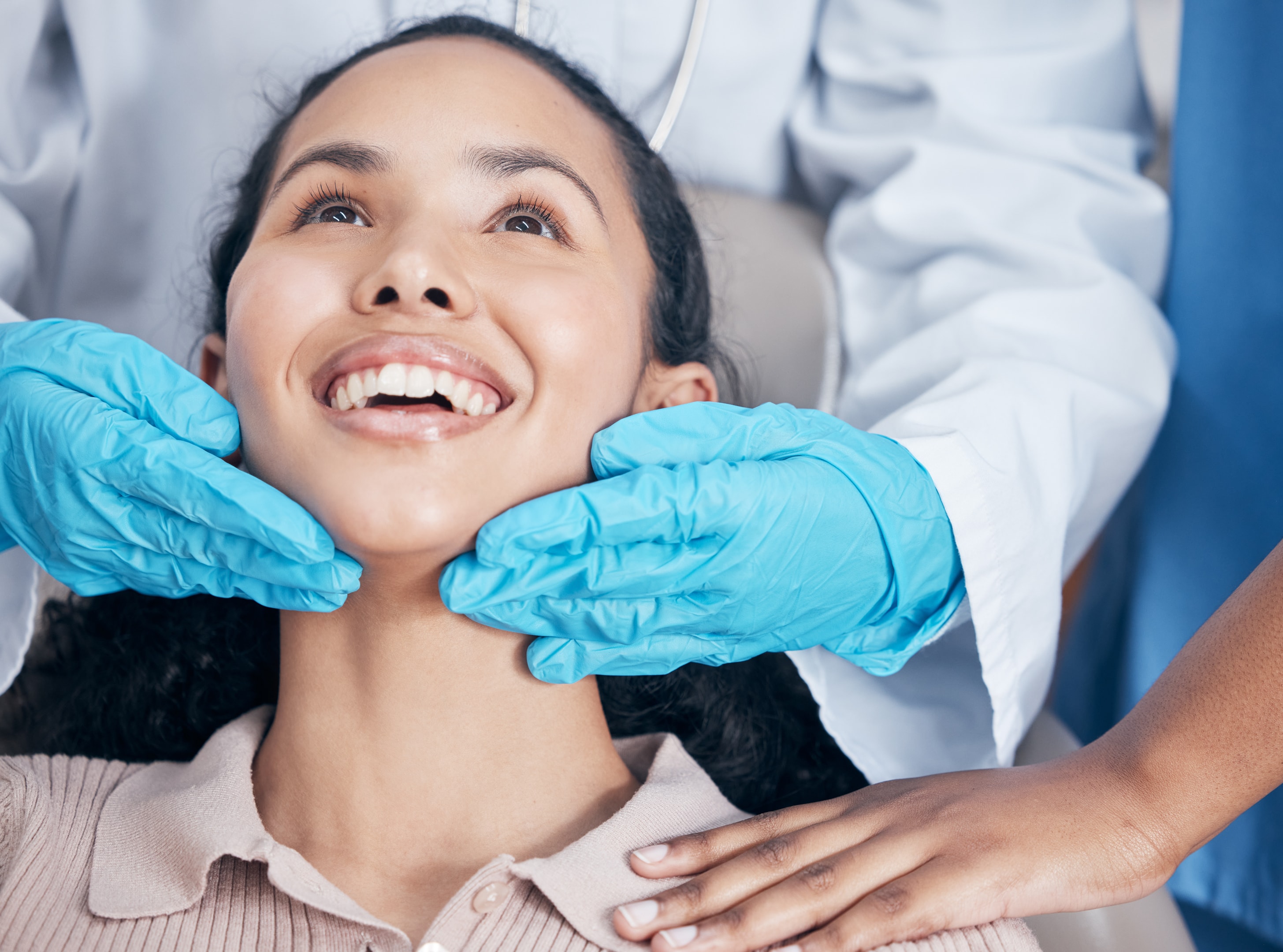 A photo of a young girl being examined before tooth extraction