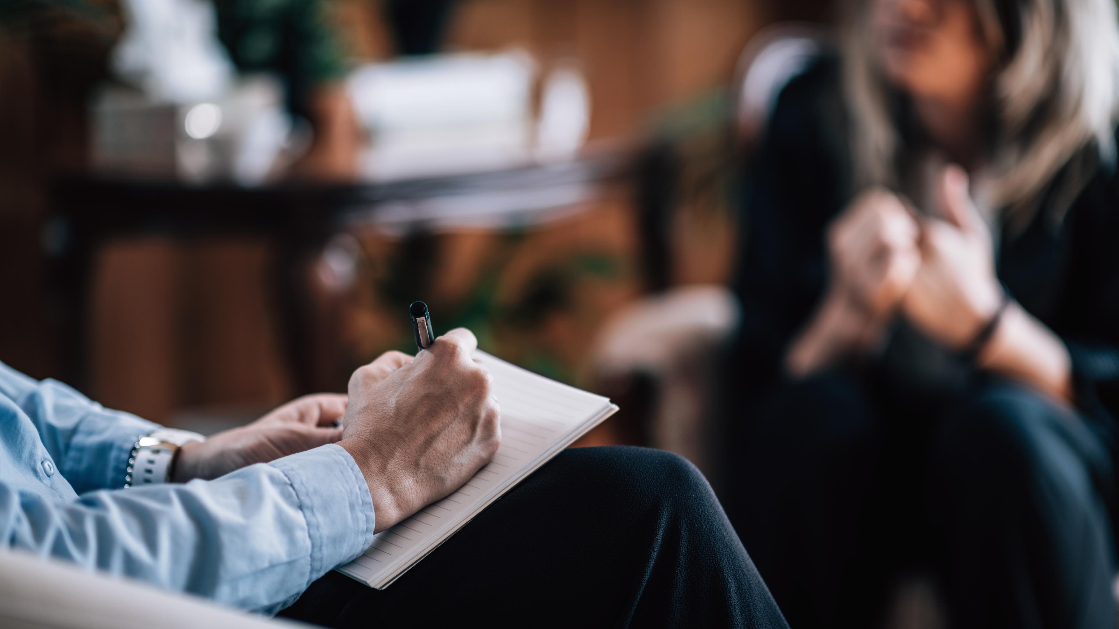 An addiction psychiatrist consults with a client demonstrating when to see addiction psychiatrist