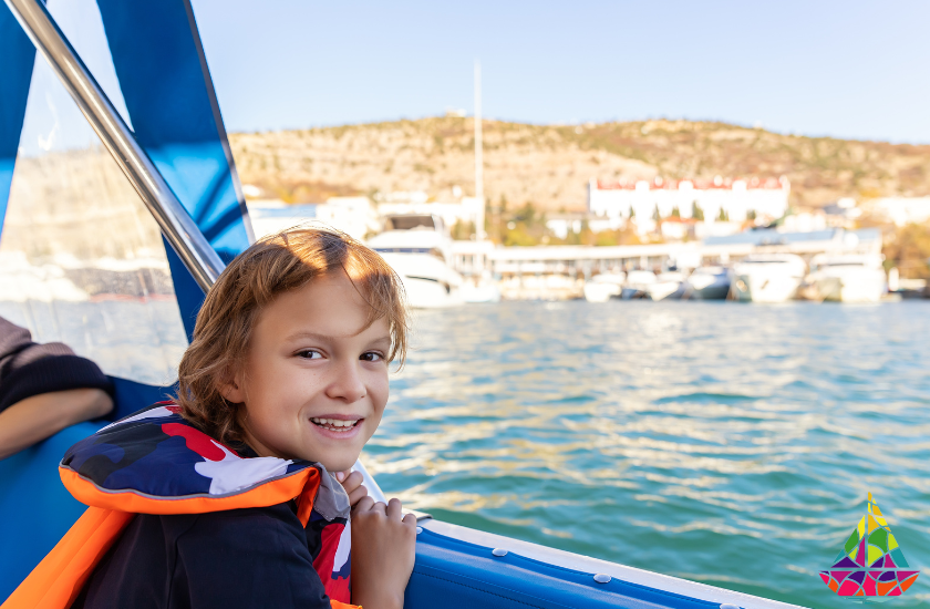 Boy smiling while on boat