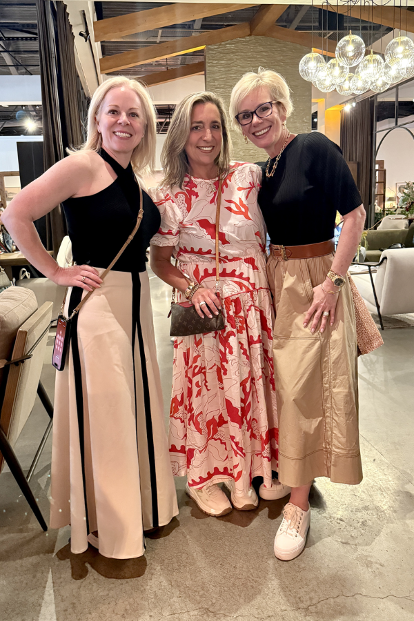 three women (all designers) stand together at High Point Market