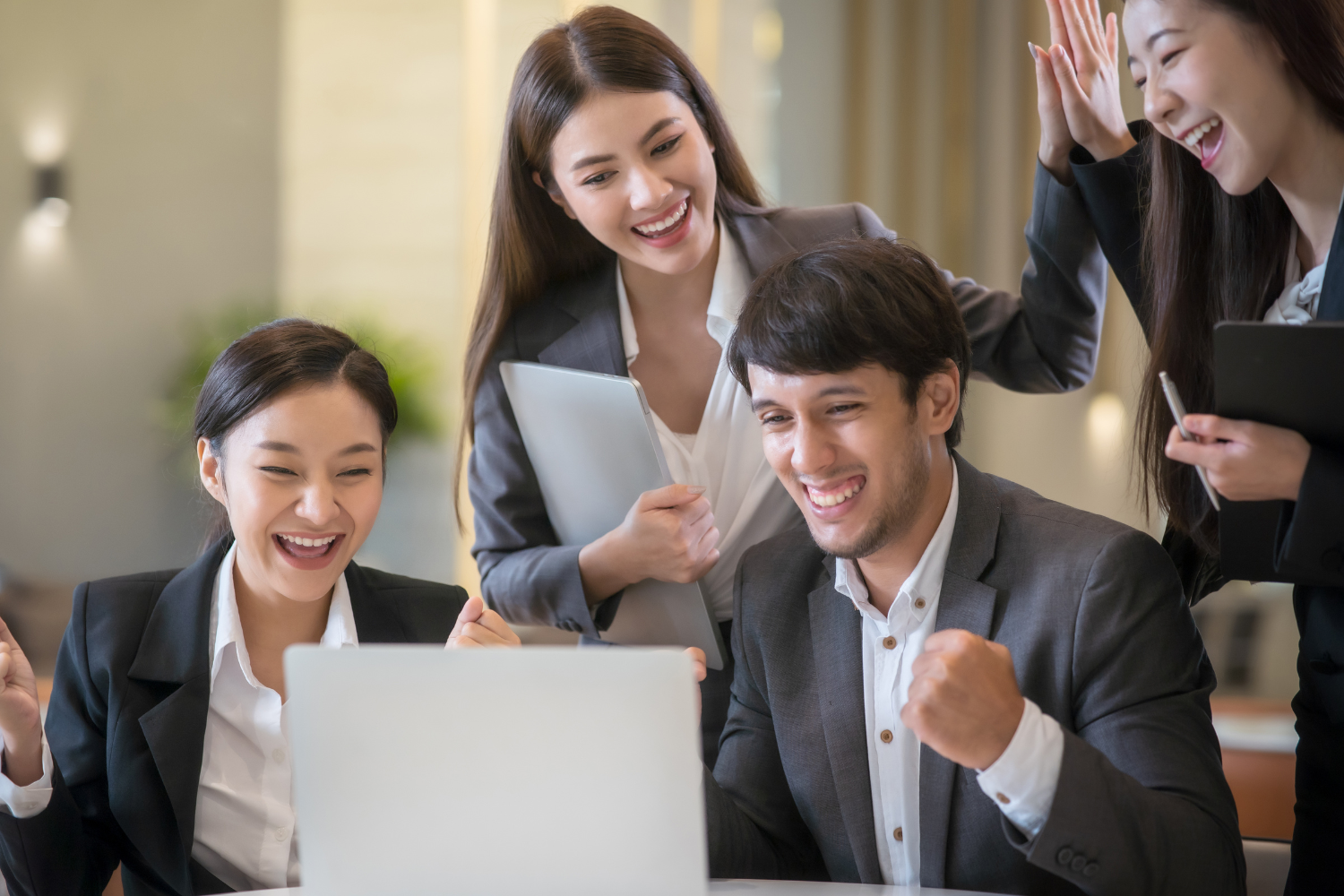 A team of employees celebrating success.
