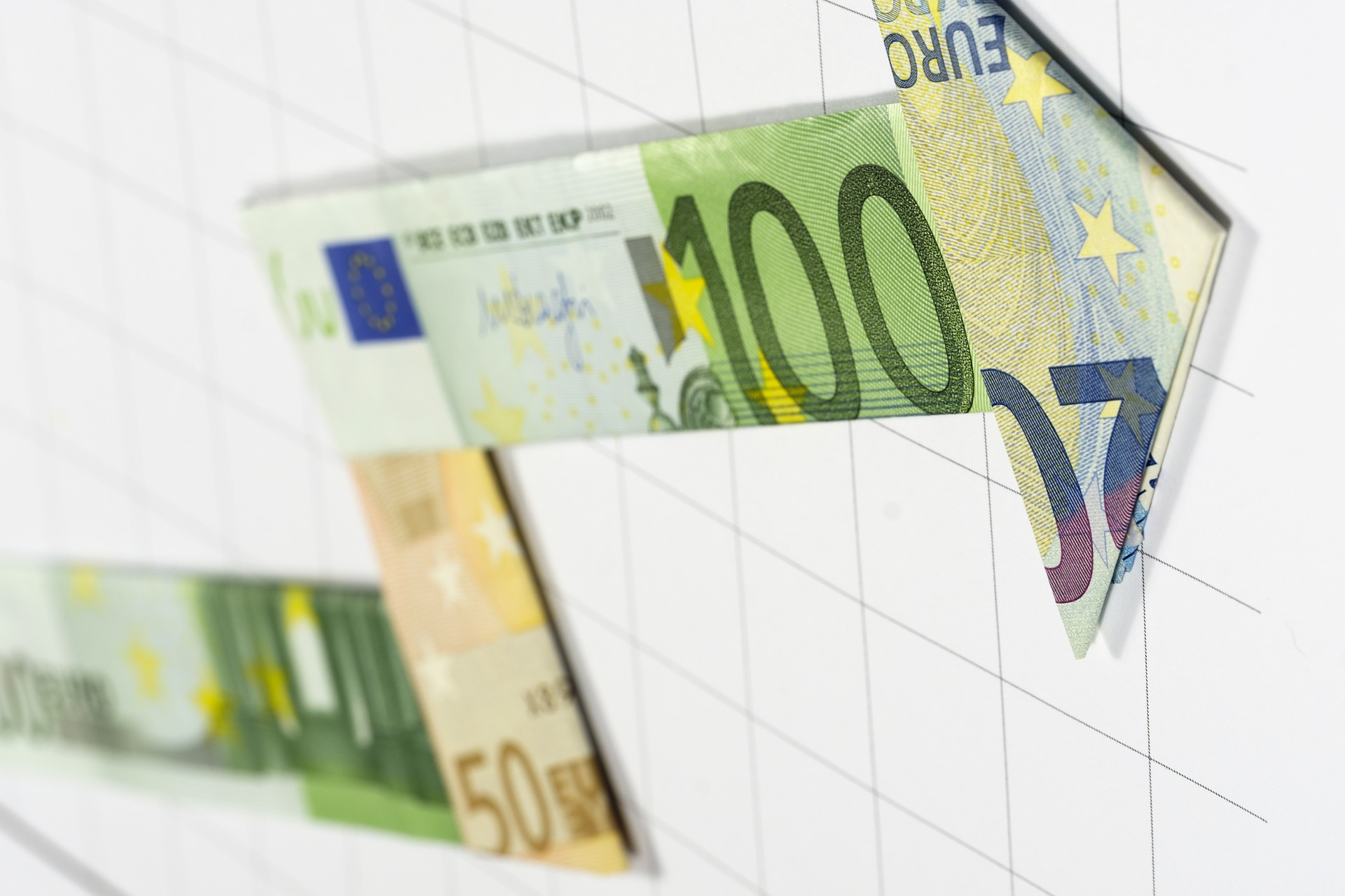 Revenue management representation: Euro notes folded into an arrow going up.