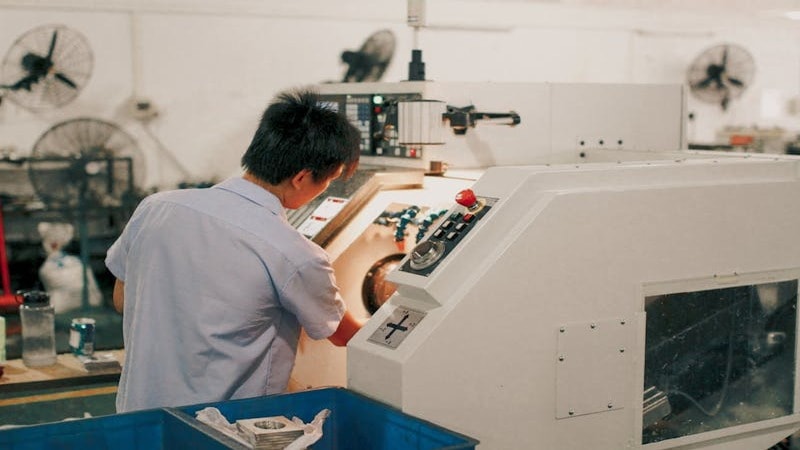 Engineer working with CNC machine