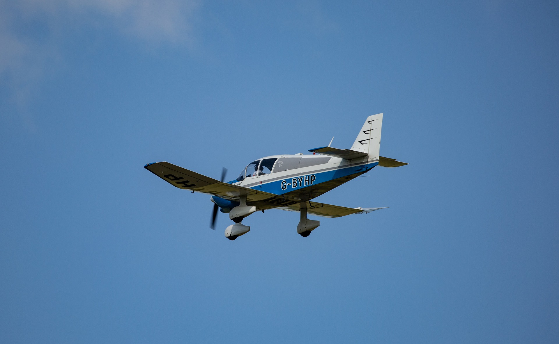 A small aircraft flying under marginal conditions for VFR.