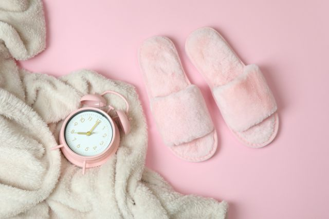 Establish a good bedtime routine - Bathrobe, clock and slippers