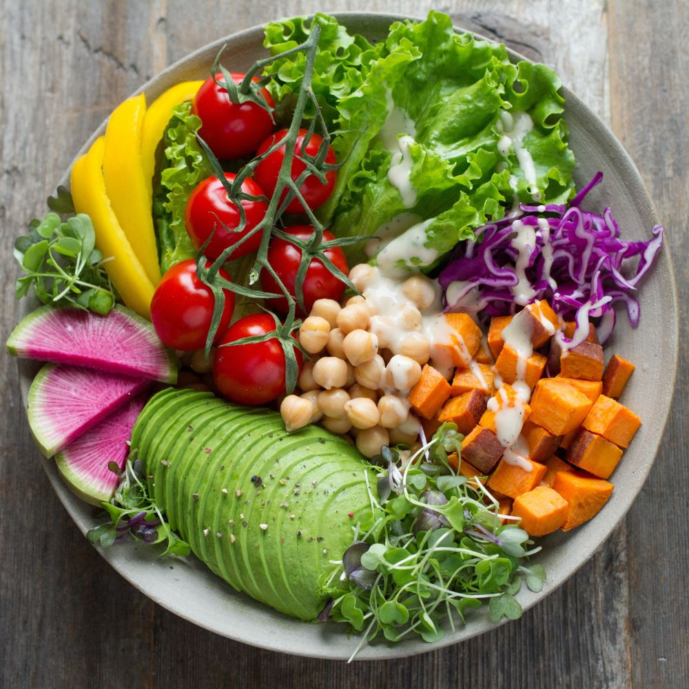 A bowl of fruits and vegetables, showing the nutritional value of whole foods.