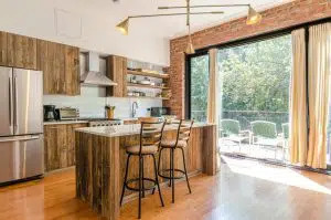 luxury designed kitchen with wood finishes to the cabinets and more