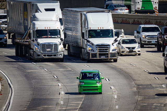 Fleet vehicles and cars driving on the road