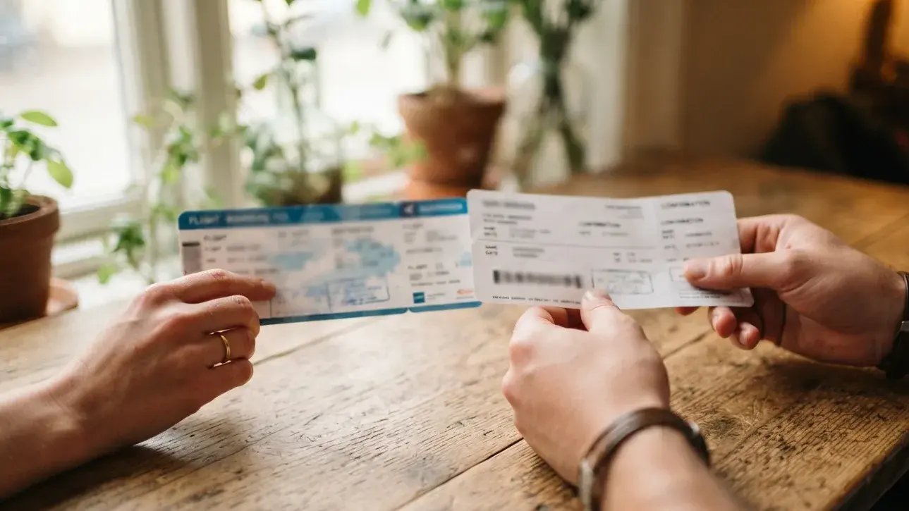 Traveler comparing revised city order with dummy hotel dates before visa submission