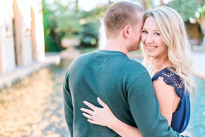 A couple posing naturally for their engagement photography in Arizona at Royal Palms Resort