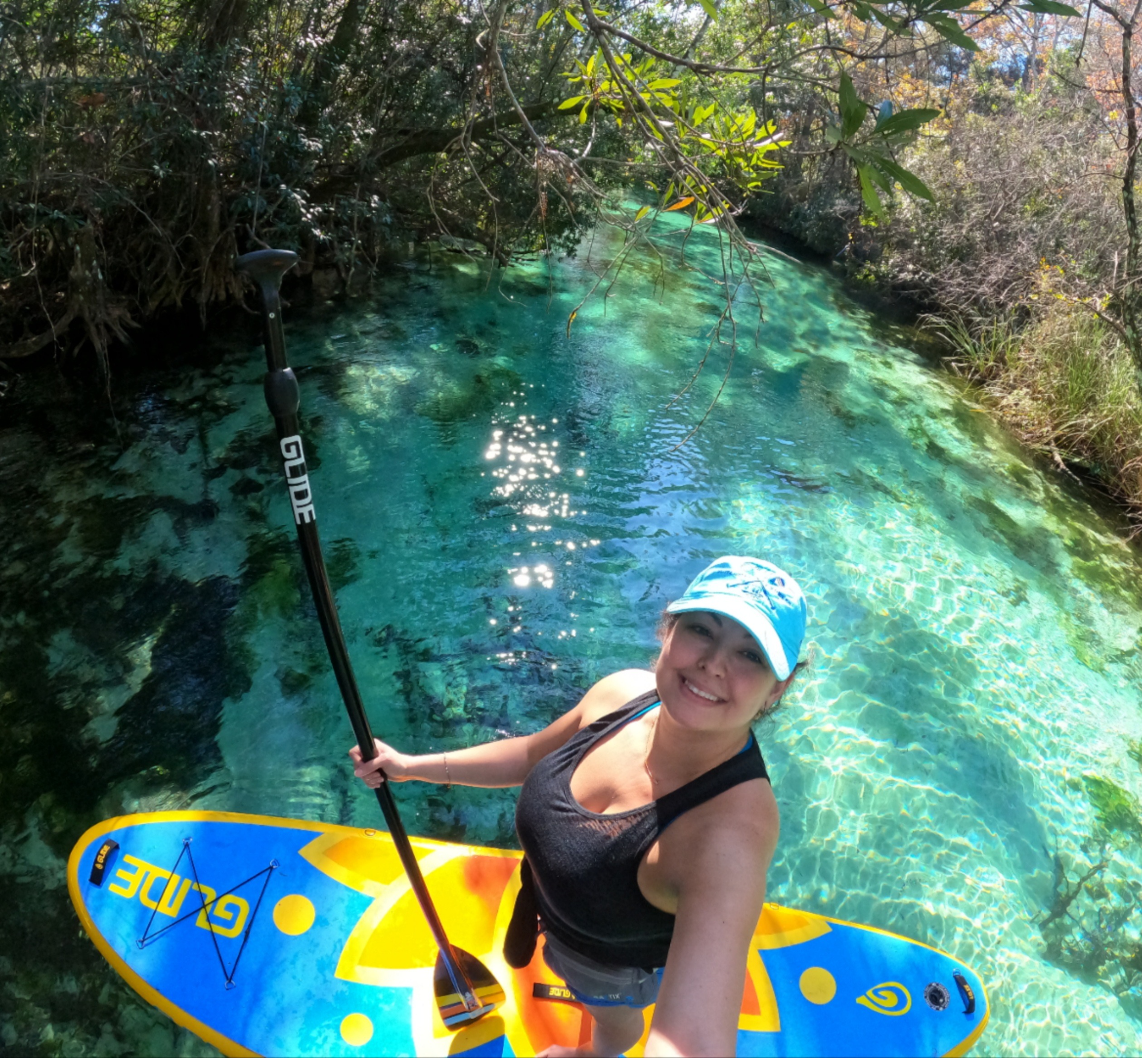 woman on an inflatable paddle board